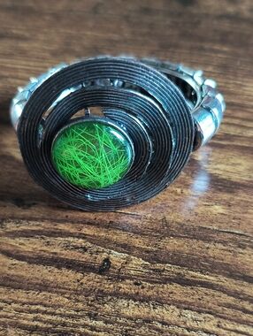 Spiral Metal Ring with Green Resin Center
